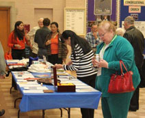 Members and guests looking over the silent auction items